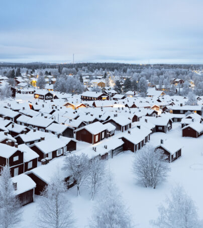 View of the medieval village of Gammelstad with traditional wooden cottages and the bell tower covered with snow and ice, Lulea, Sweden, UNESCO World Heritage site, Lapland, Scandinavia, Europe